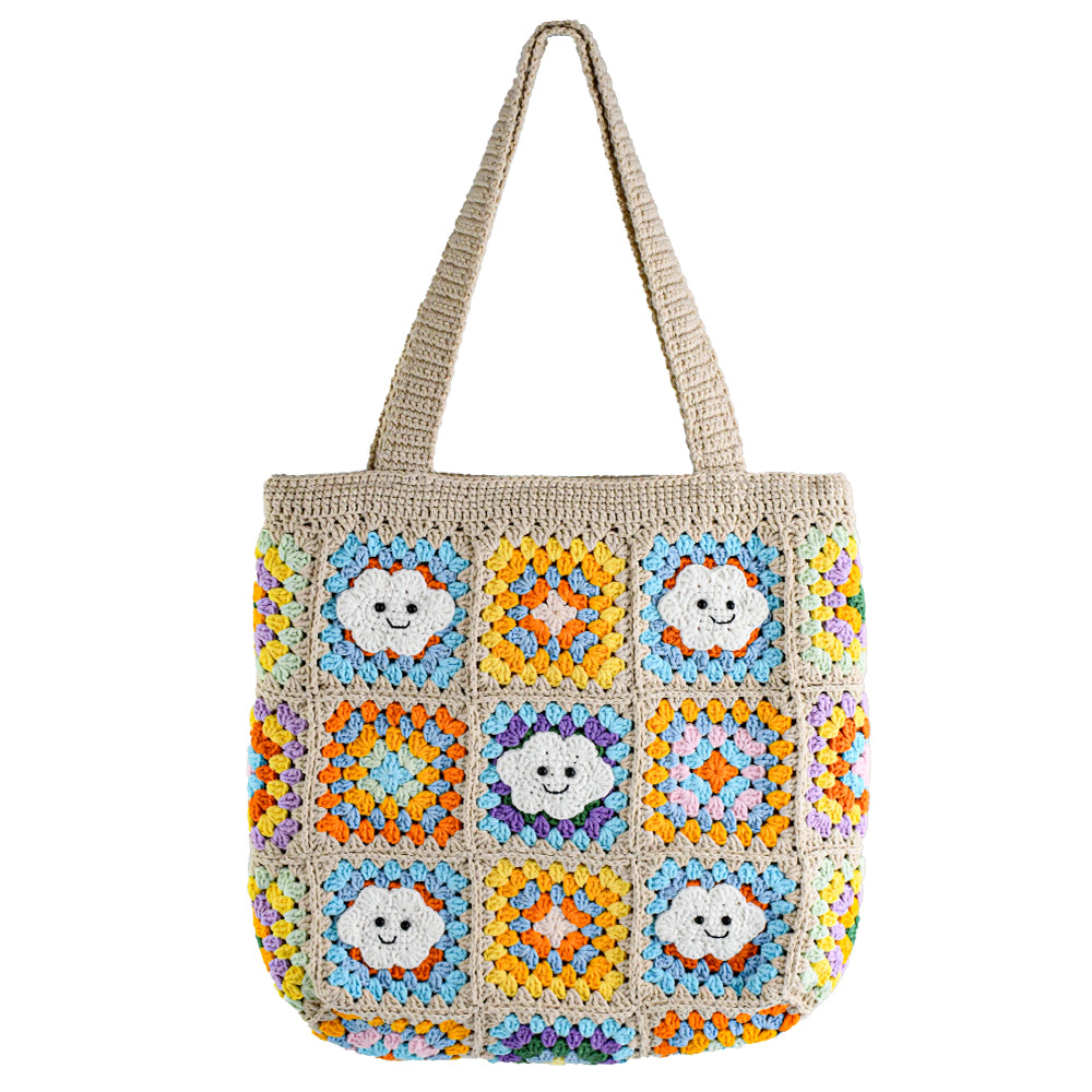 Handmade crochet tote bag with smiling cloud motifs and colorful patchwork squares in beige, yellow, blue, orange, and purple. Lightweight, eco-friendly, and spacious design, perfect for daily use or casual outings.