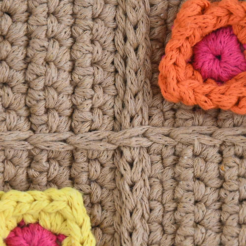 Handmade crochet shoulder bag with a beige base and colorful 3D floral square patterns. Features a soft adjustable strap and spacious interior, perfect for daily use, shopping, or travel.