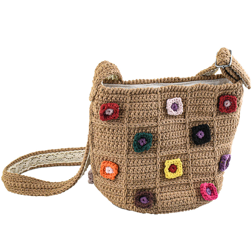 Handmade crochet shoulder bag with a beige base and colorful 3D floral square patterns. Features a soft adjustable strap and spacious interior, perfect for daily use, shopping, or travel.