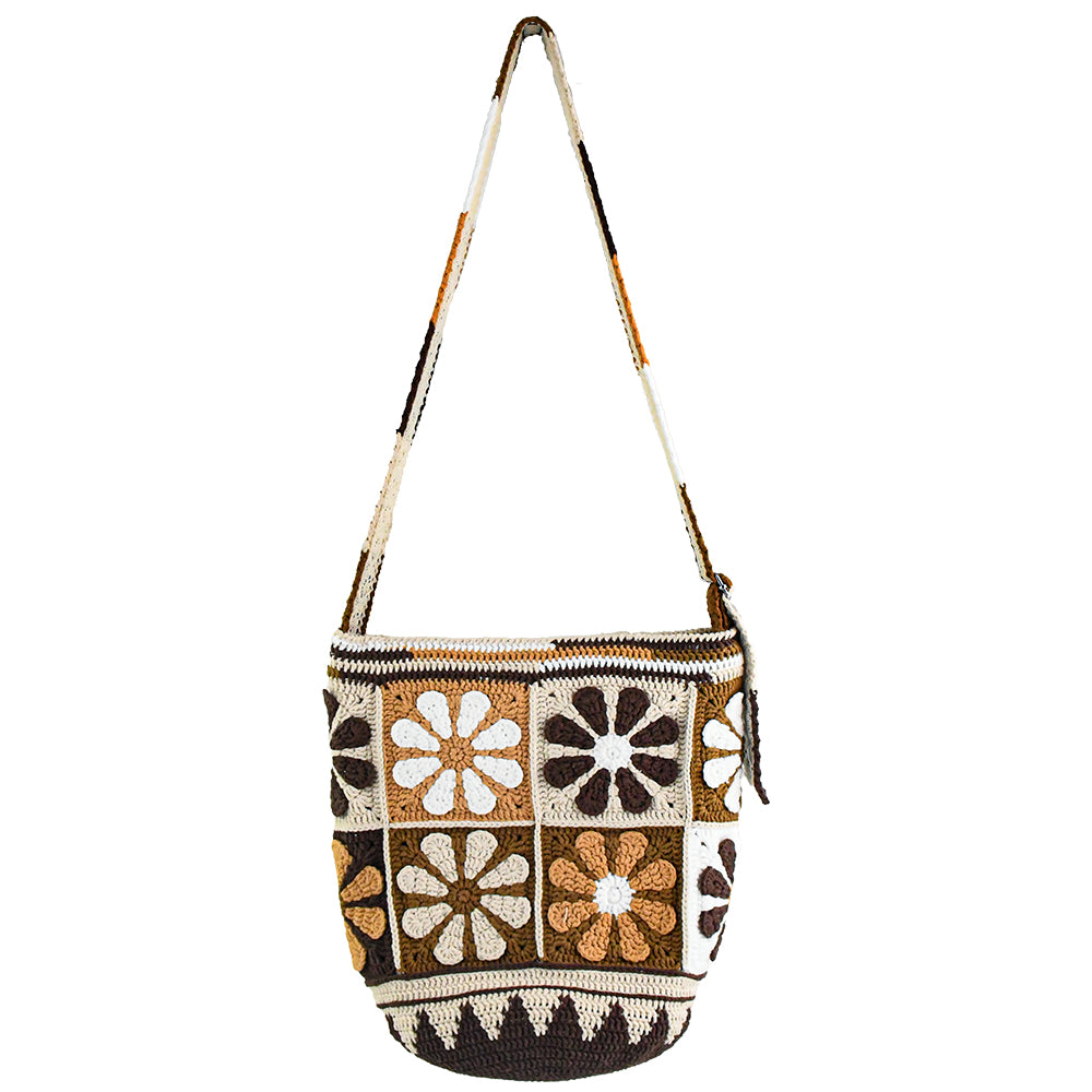 Handmade crochet shoulder bag with retro floral square patterns in earthy tones of brown, beige, and white. Features a long adjustable strap and a spacious bucket-style design, perfect for casual outings or shopping.