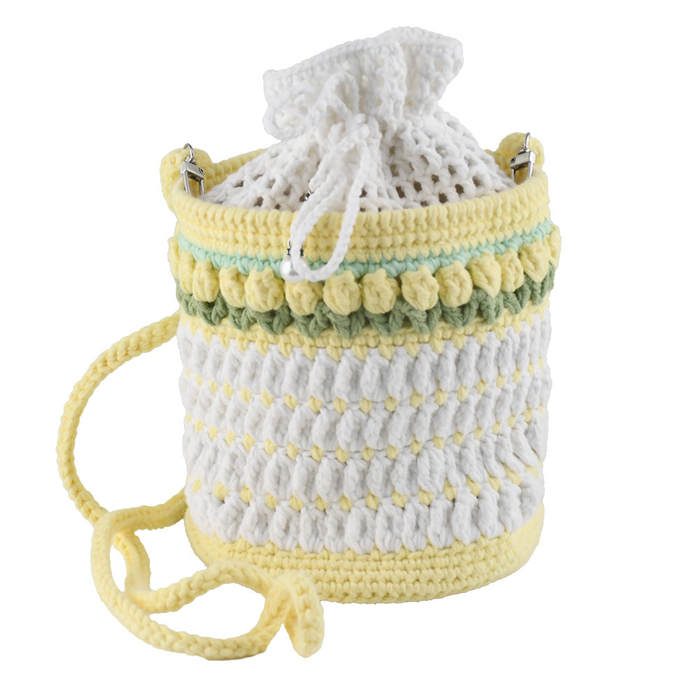 Handmade crochet bucket bag in white and yellow with pearl details, drawstring closure and adjustable shoulder strap

