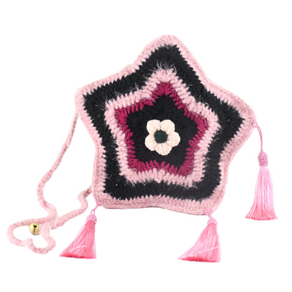Handmade star-shaped crochet bag in pink and black with three pink tassels, white flower center, and braided shoulder strap
