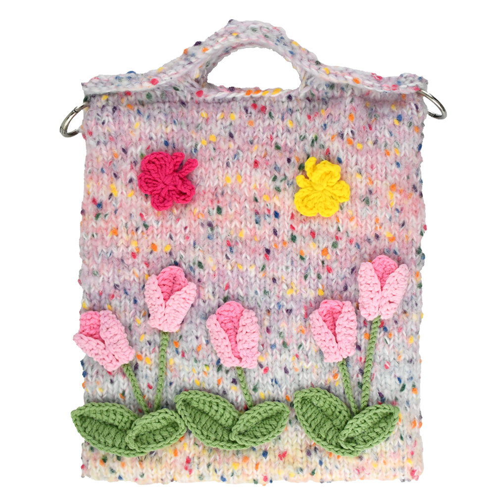 Handwoven knit bag with pink 3D flowers and green leaves, featuring a colorful dotted background, soft and durable, ideal for daily use or decoration.