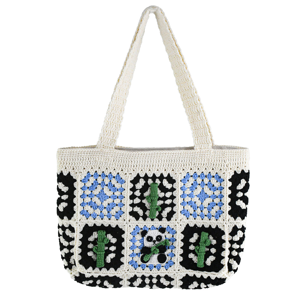 Handmade crochet tote bag featuring a panda design with bamboo patterns, blue and black square details, and a soft white base. Perfect for casual outings or eco-friendly shopping.