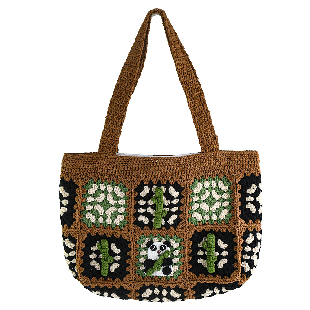 Handmade crochet patchwork bag with a brown base, black, green, and white patterns, featuring a panda and bamboo design in the center. Vintage style, eco-friendly, and lightweight, ideal for shopping or daily use.