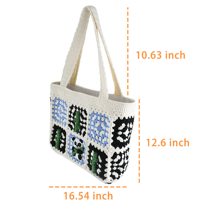 Handmade crochet tote bag featuring a panda design with bamboo patterns, blue and black square details, and a soft white base. Perfect for casual outings or eco-friendly shopping.