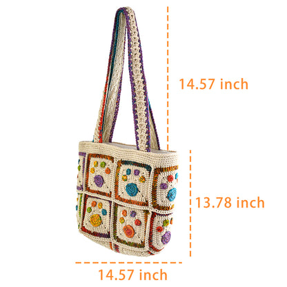 Handmade crochet tote bag with colorful floral and paw patterns, featuring a beige base and multicolor woven straps. Lightweight and spacious, perfect for casual outings or daily use.