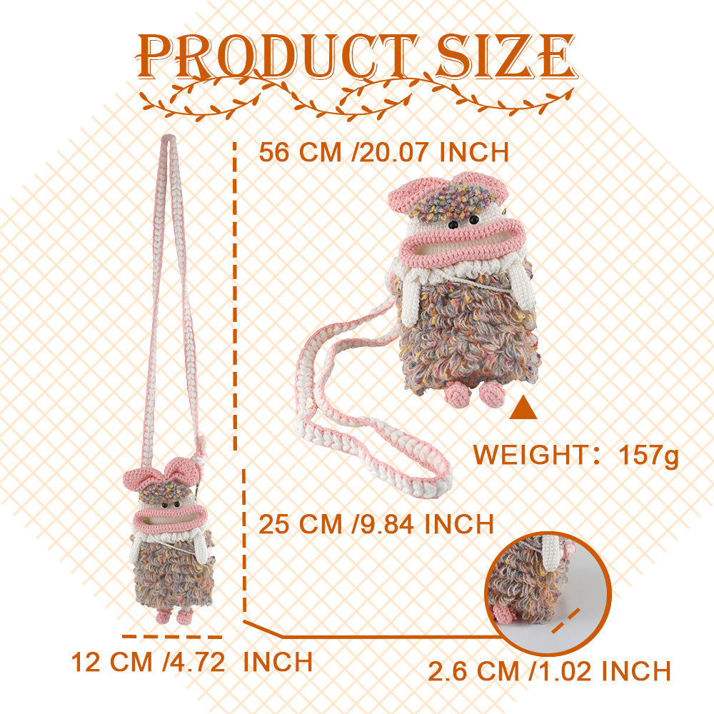 Handcrafted pink crochet doll crossbody phone pouch with zipper closure and cute facial details
