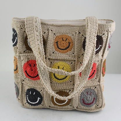 Handmade crochet tote bag with colorful smiley face patterns, featuring a beige base and sturdy knitted straps. Lightweight and spacious, perfect for casual outings, shopping, or daily use.