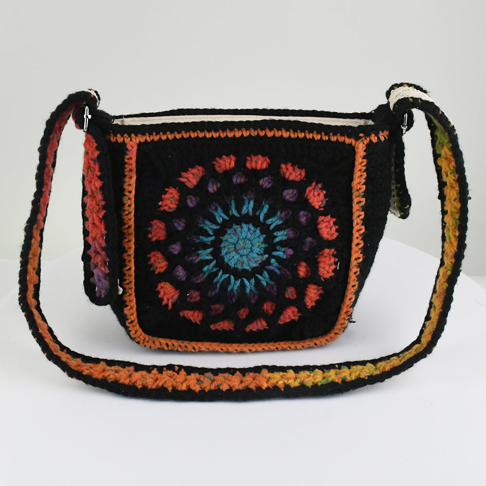 Handmade crochet shoulder bag featuring a Dunhuang-inspired mandala pattern in vibrant colors, with an adjustable strap and flap closure.