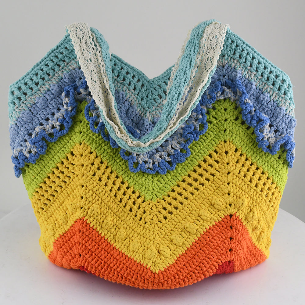 Handmade crochet tote bag with a vibrant rainbow wave pattern. Features eco-friendly yarn, spacious design, and soft fabric handles. Perfect for shopping, beach trips, or casual outings