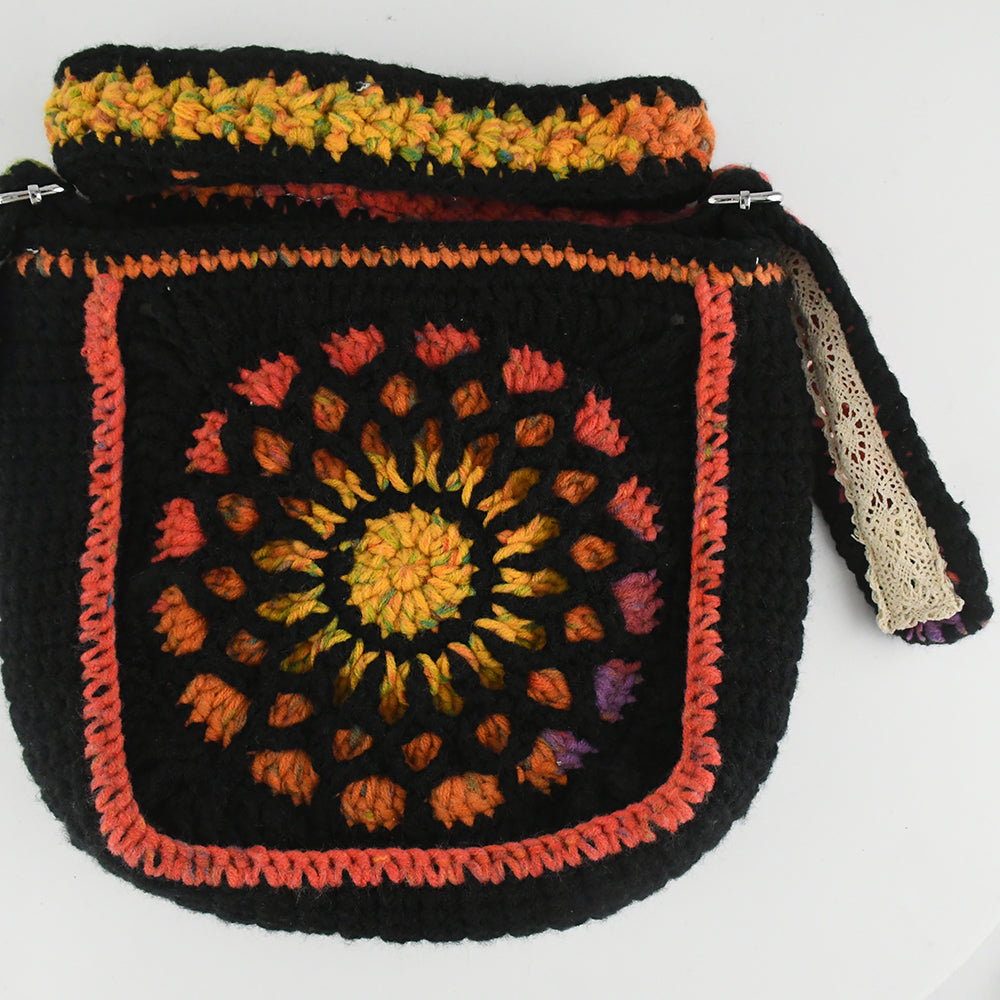 Handmade crochet shoulder bag featuring a Dunhuang-inspired mandala pattern in vibrant colors, with an adjustable strap and flap closure.