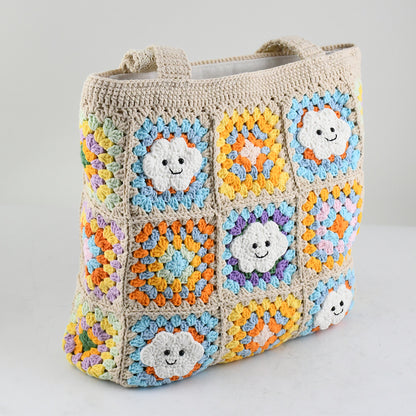 Handmade crochet tote bag with smiling cloud motifs and colorful patchwork squares in beige, yellow, blue, orange, and purple. Lightweight, eco-friendly, and spacious design, perfect for daily use or casual outings.