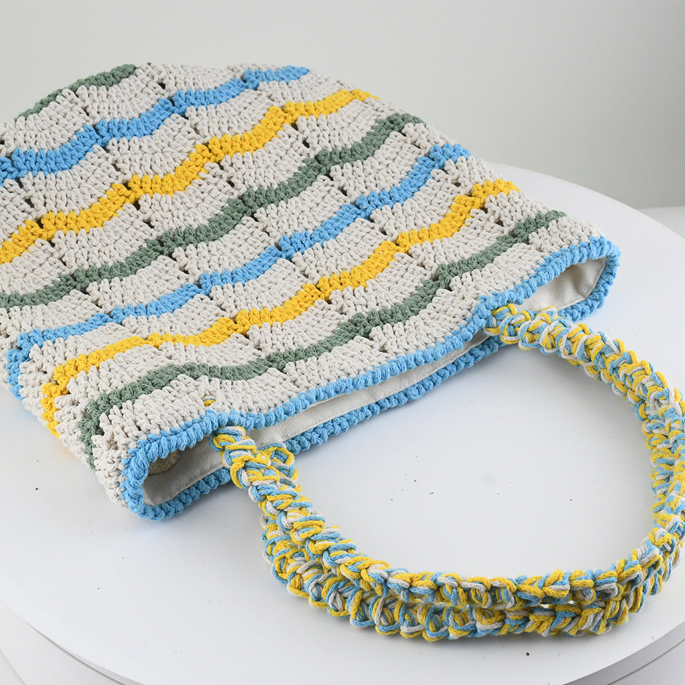 Handwoven crochet tote bag with colorful wave patterns in blue, yellow, green, and cream. Features a braided handle and lightweight, eco-friendly design. Perfect for everyday use, shopping, or beach trips.