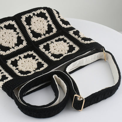 Handmade crochet crossbody bag with a black and white patchwork design, featuring square floral patterns, an adjustable strap, and a soft, lightweight texture.