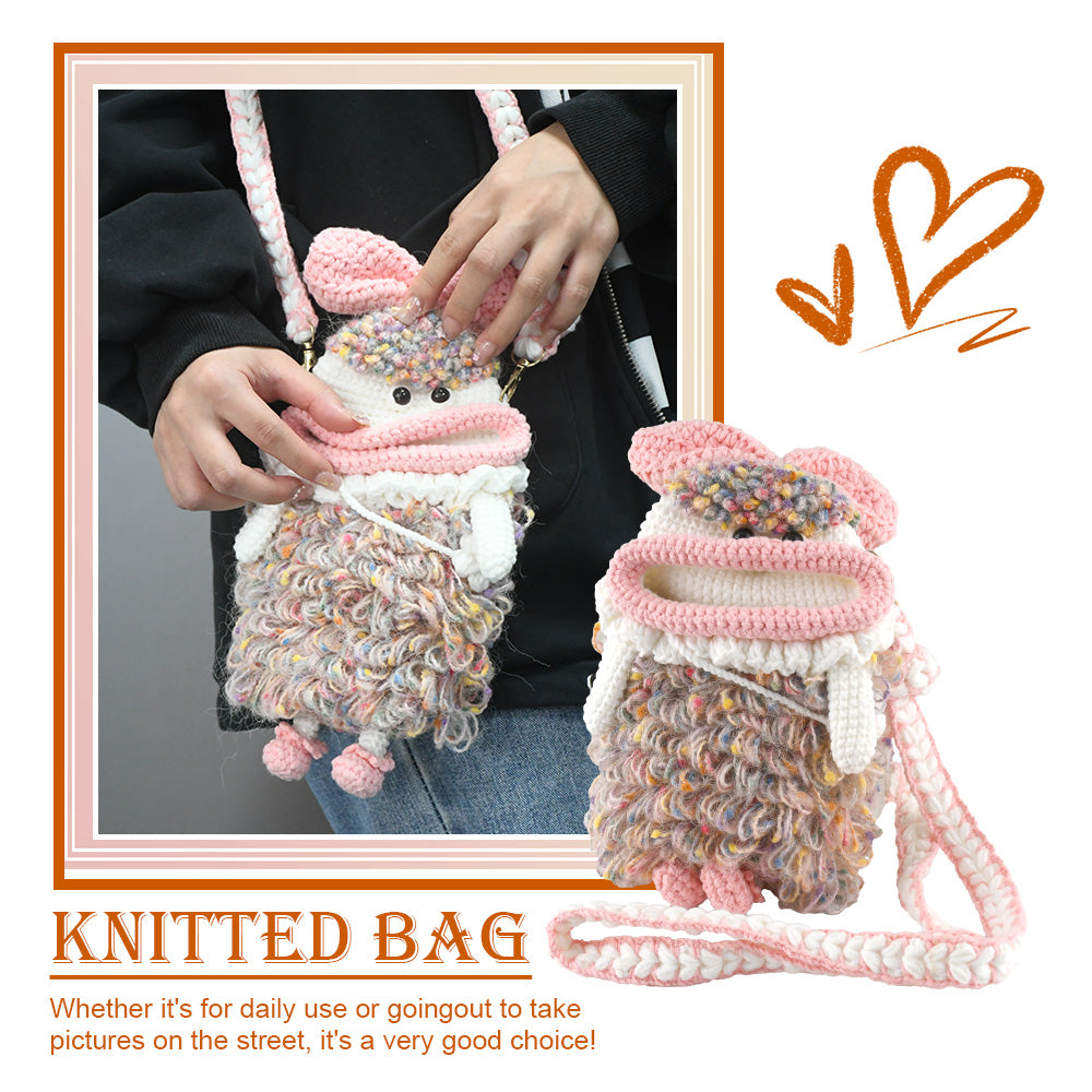 Handcrafted pink crochet doll crossbody phone pouch with zipper closure and cute facial details
