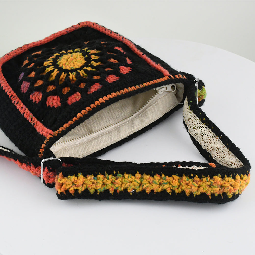 Handmade crochet shoulder bag featuring a Dunhuang-inspired mandala pattern in vibrant colors, with an adjustable strap and flap closure.