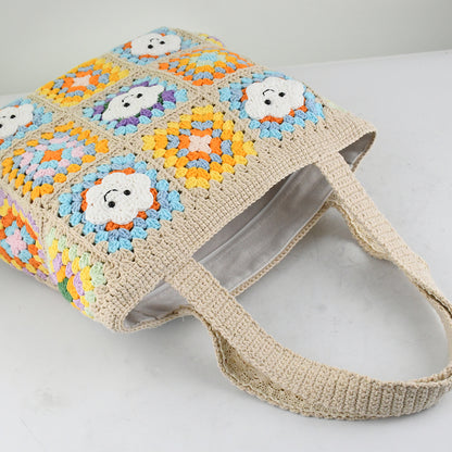 Handmade crochet tote bag with smiling cloud motifs and colorful patchwork squares in beige, yellow, blue, orange, and purple. Lightweight, eco-friendly, and spacious design, perfect for daily use or casual outings.