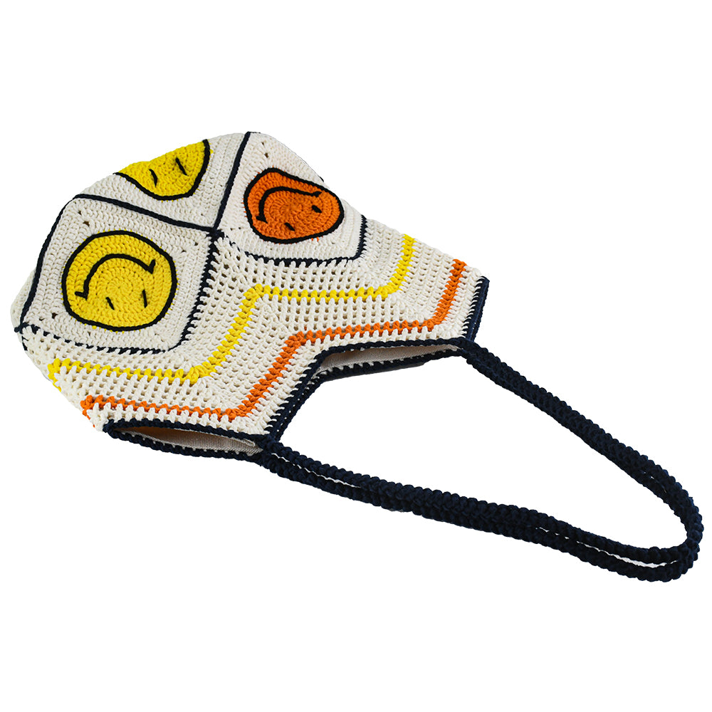 Handmade crochet tote bag with a white base, colorful chevron pattern, and three smiley face designs in orange, yellow, and navy. Features a soft navy strap and a spacious interior, perfect for casual outings or travel.