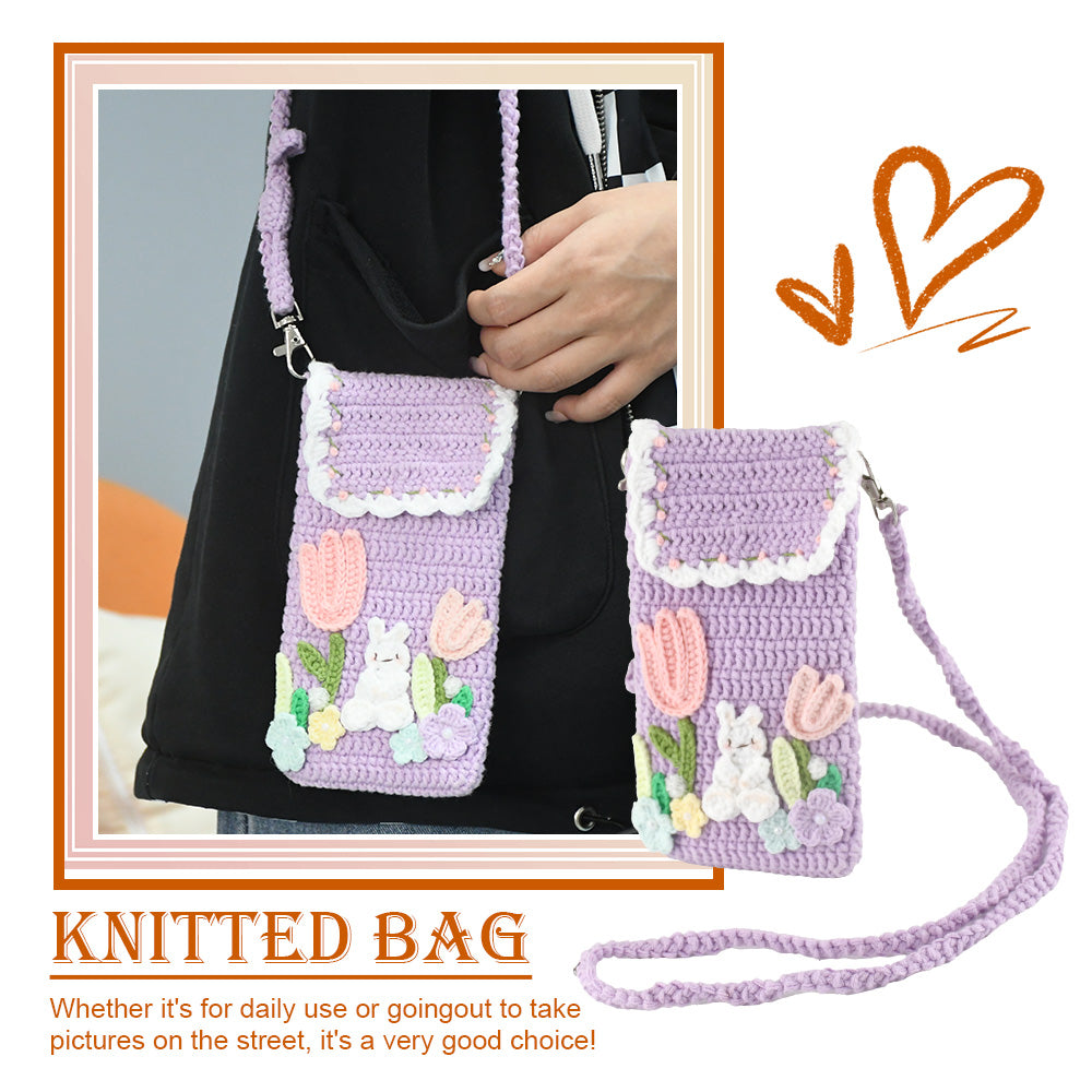 Purple crochet phone pouch with pink tulips, white bunny, and pastel flowers, featuring braided shoulder strap
