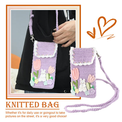 Purple crochet phone pouch with pink tulips, white bunny, and pastel flowers, featuring braided shoulder strap
