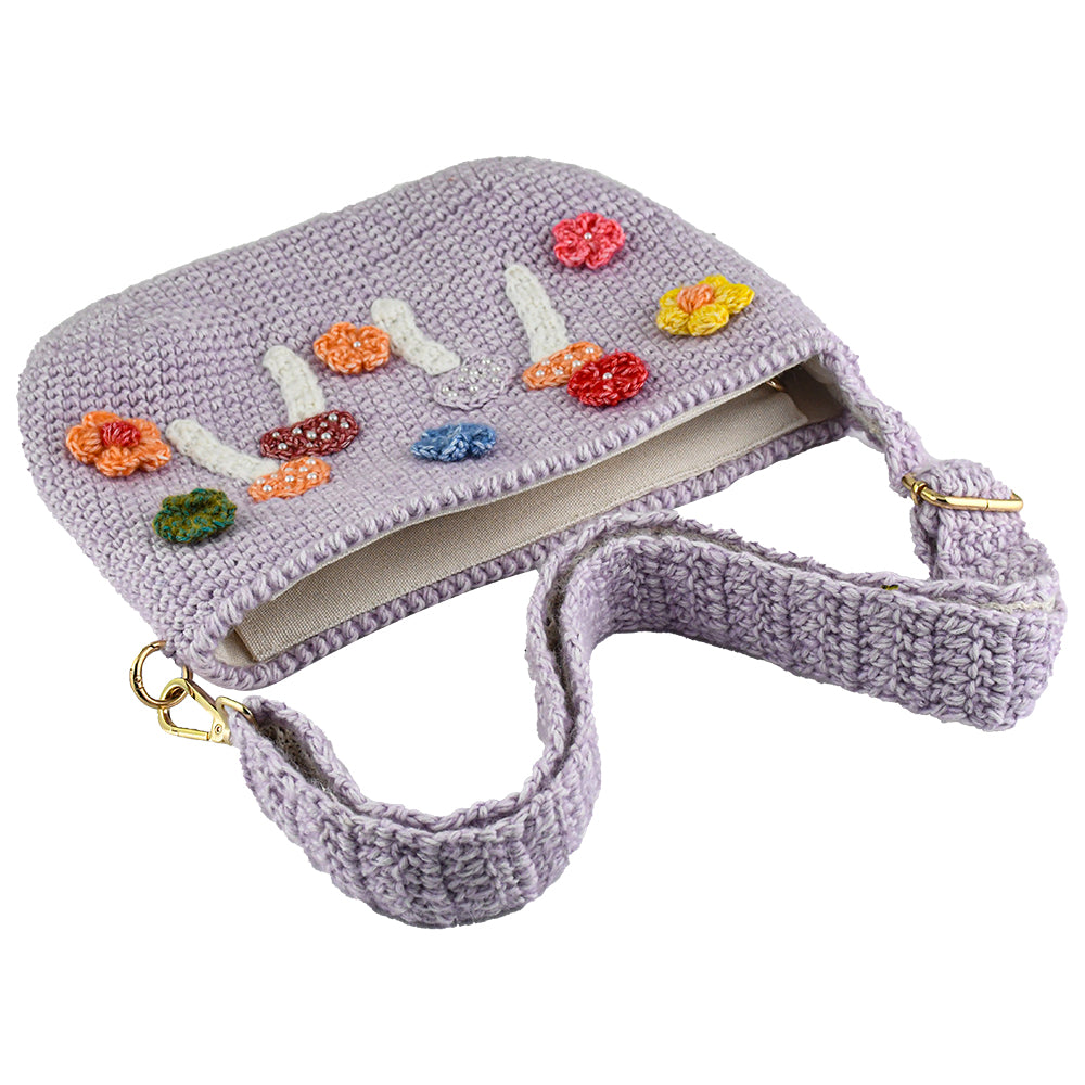 Handmade lavender crochet shoulder bag decorated with colorful mushrooms and flowers. Lightweight, eco-friendly, and perfect for daily use or travel.