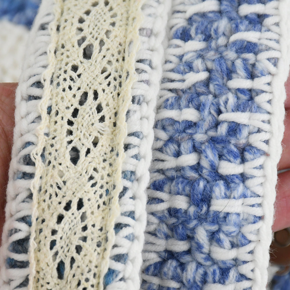 Handmade crochet shoulder bag with a unique blue and white floral pattern, featuring an adjustable strap and secure flap closure. Lightweight and perfect for everyday use.