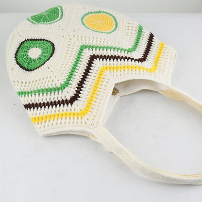 Handmade crochet tote bag with vibrant citrus patterns, featuring a beige base and colorful yellow, green, and brown details. Lightweight, eco-friendly, and perfect for summer beach outings or daily use.