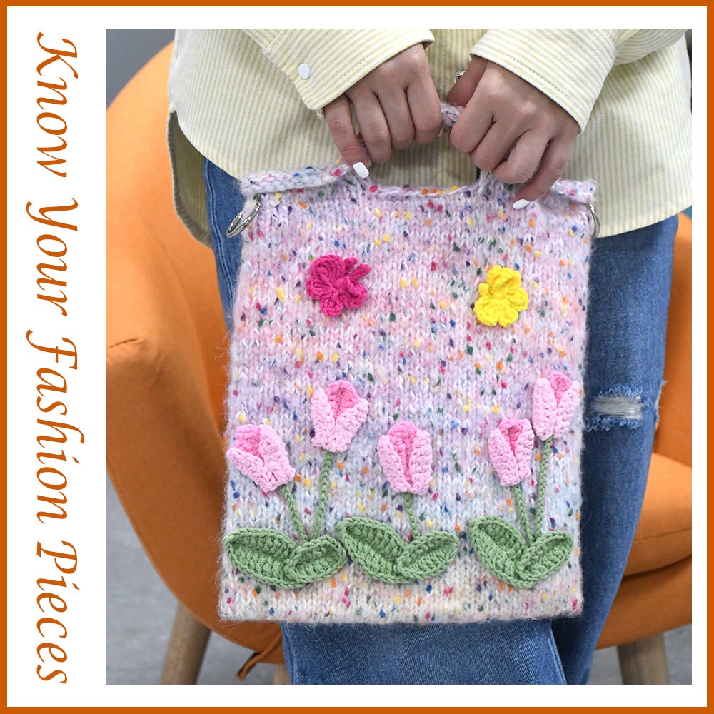 Handwoven knit bag with pink 3D flowers and green leaves, featuring a colorful dotted background, soft and durable, ideal for daily use or decoration.