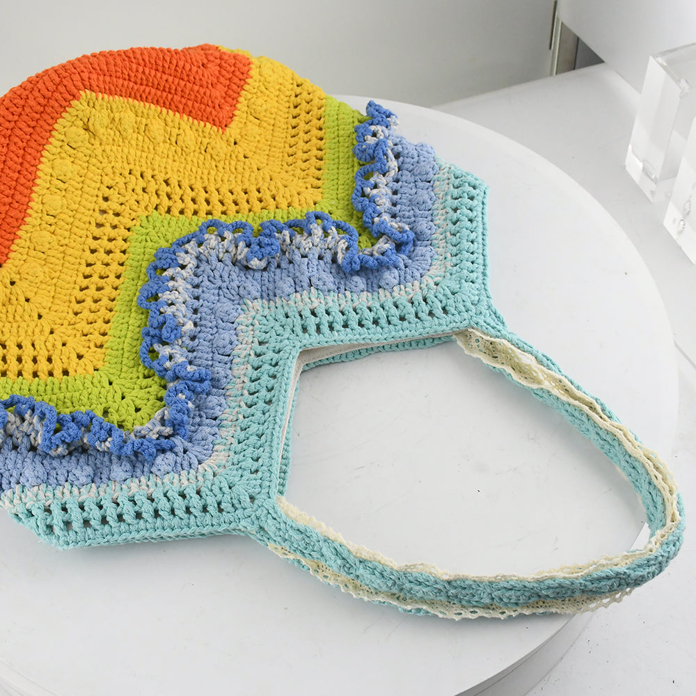 Handmade crochet tote bag with a vibrant rainbow wave pattern. Features eco-friendly yarn, spacious design, and soft fabric handles. Perfect for shopping, beach trips, or casual outings