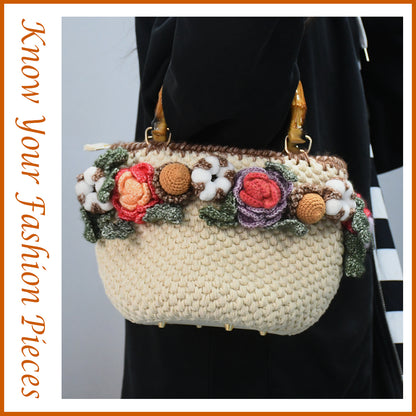 Handwoven cotton tote bag with bamboo handles, decorated with crochet flowers in pink, coral, purple and white cotton blooms, natural beige base
