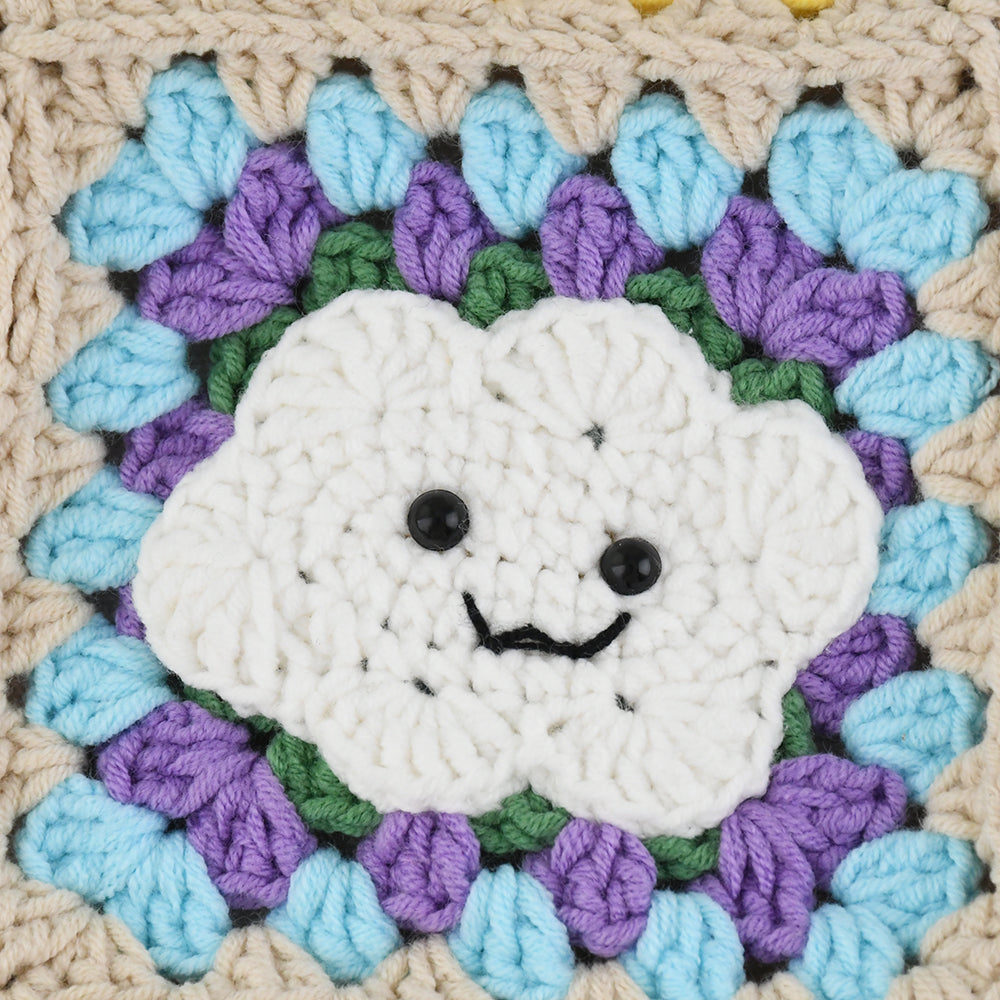 Handmade crochet tote bag with smiling cloud motifs and colorful patchwork squares in beige, yellow, blue, orange, and purple. Lightweight, eco-friendly, and spacious design, perfect for daily use or casual outings.