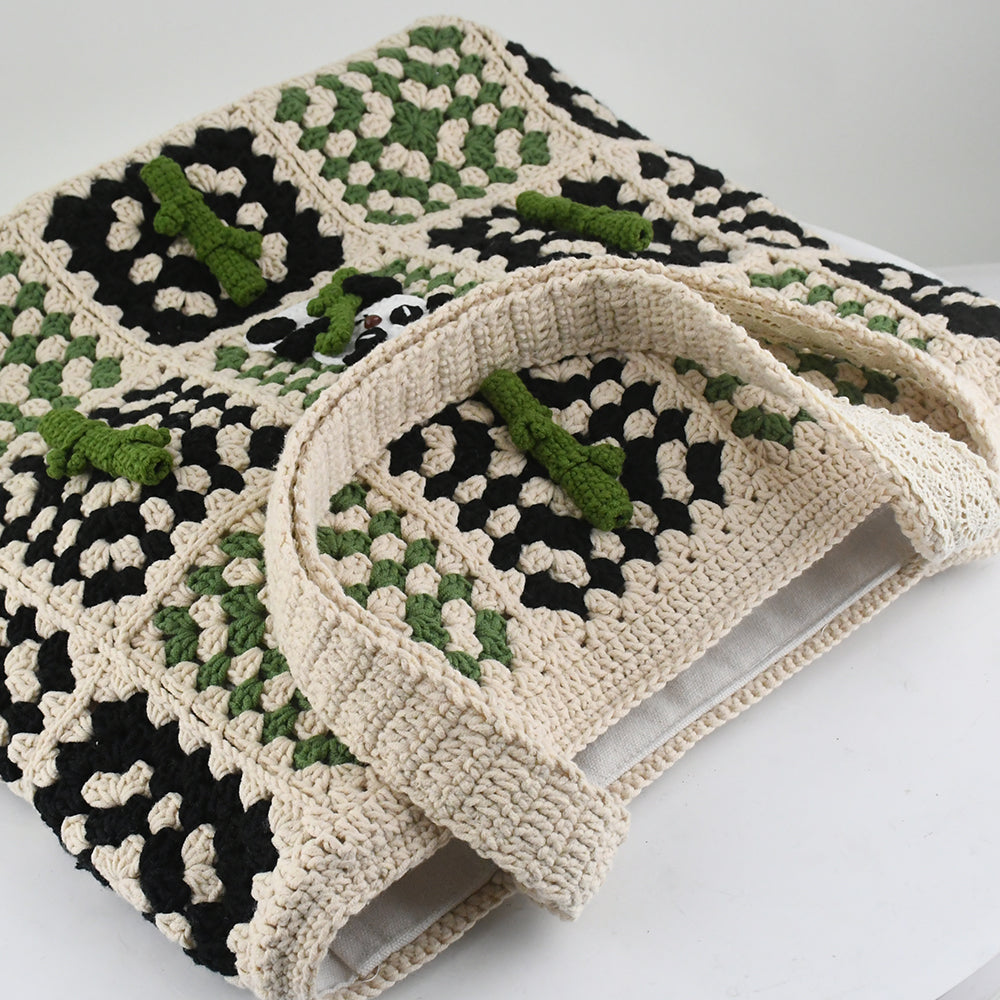 Handmade crochet patchwork bag with a beige, green, and black design. Features a cute panda and bamboo pattern in the center, vintage style, lightweight, and practical for shopping, travel, or daily use.